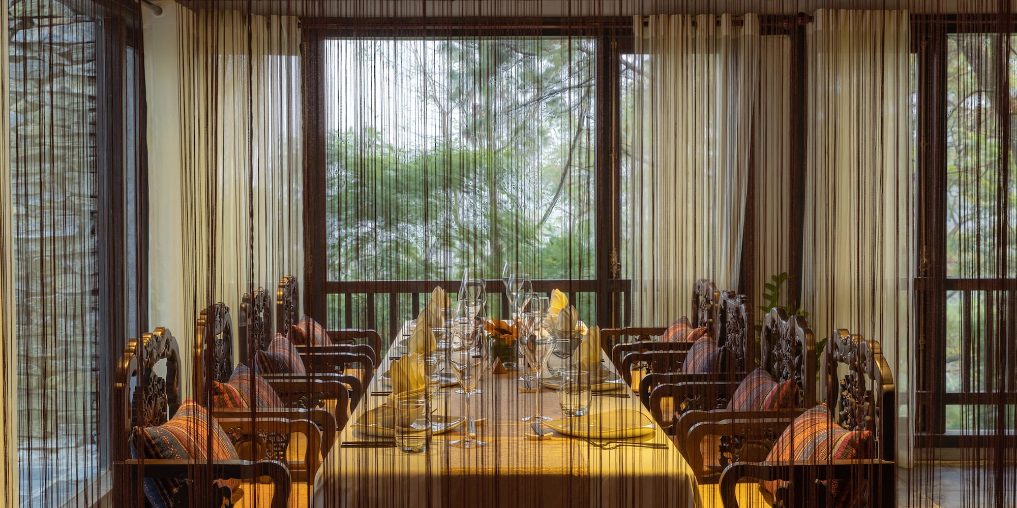 a dining room with a table and chairs
