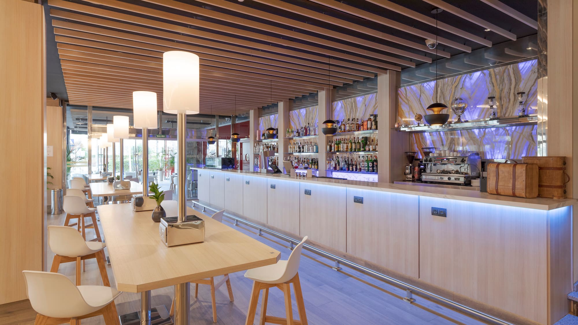 a bar with a table and chairs