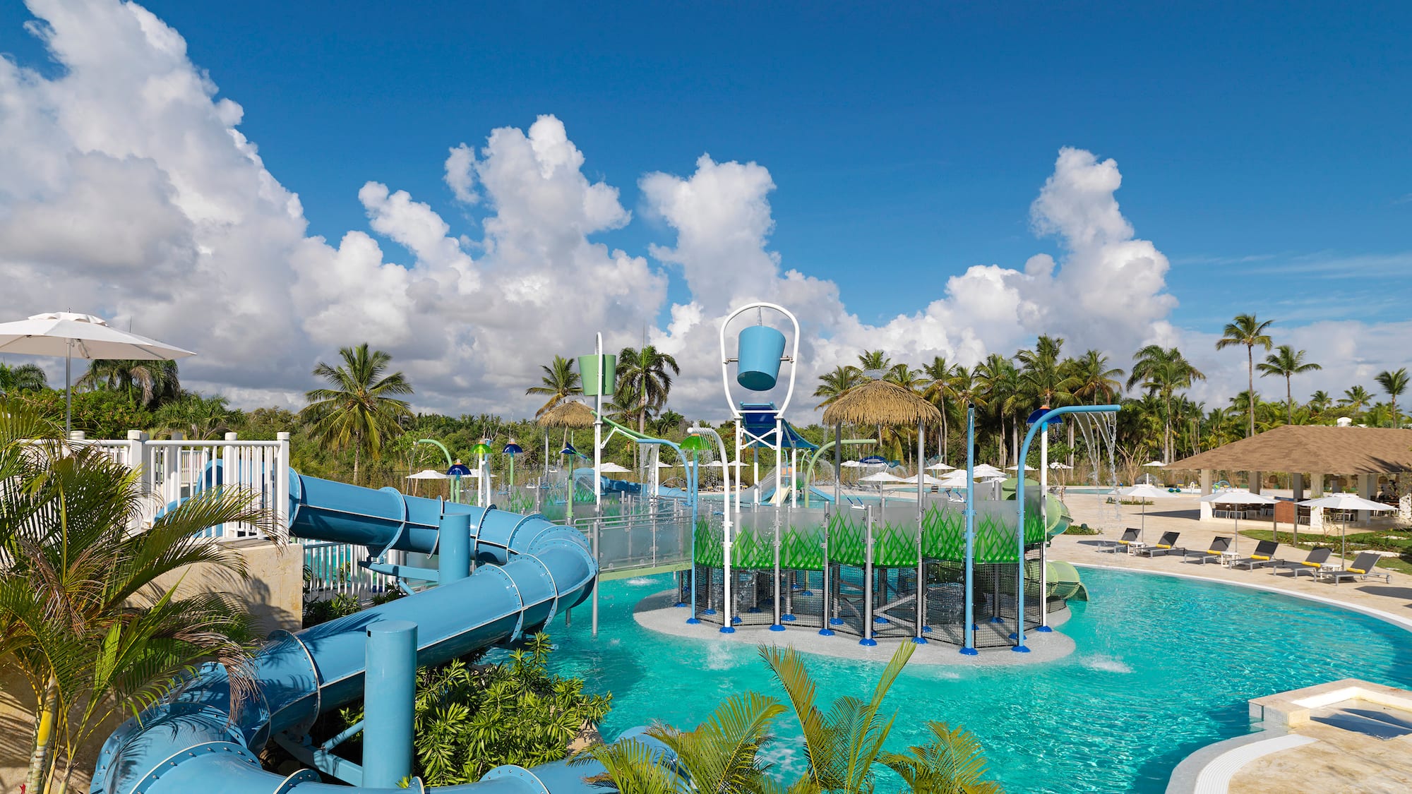 a water park with a slide and a pool