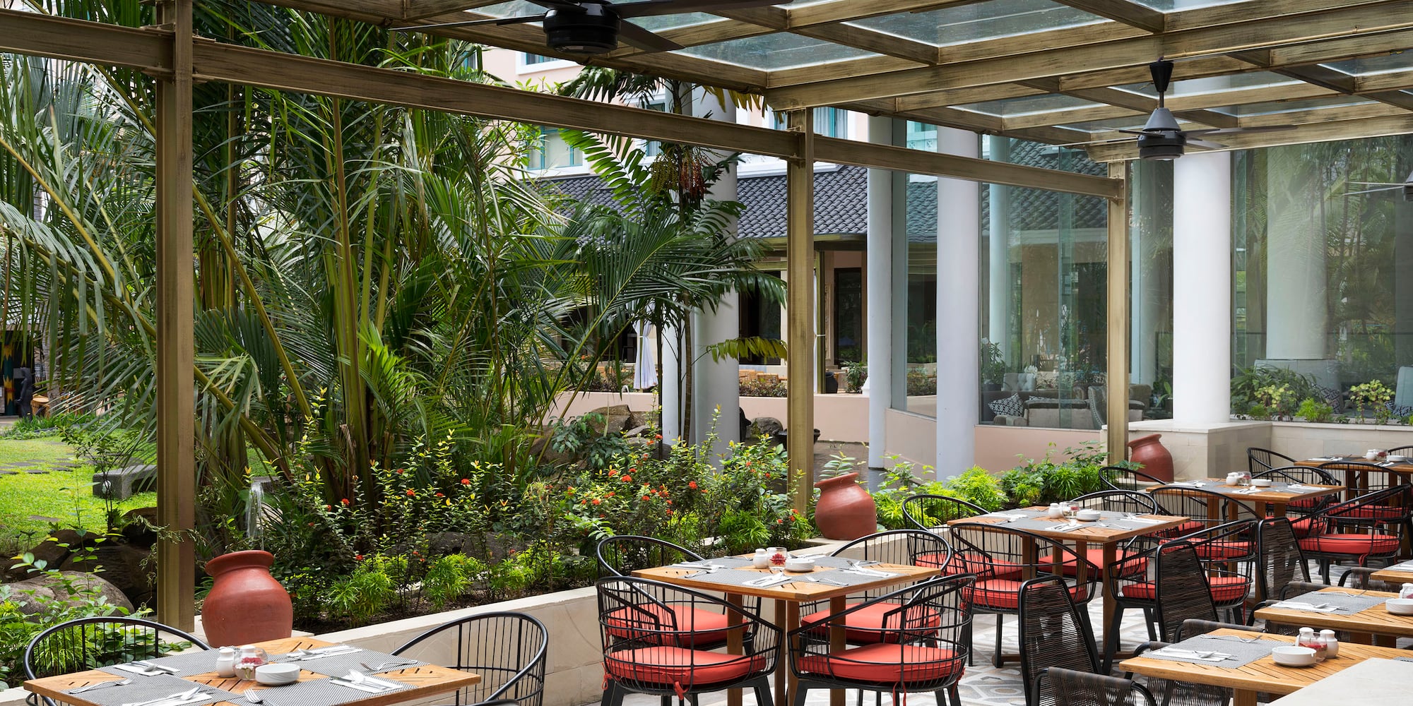 a patio with tables and chairs