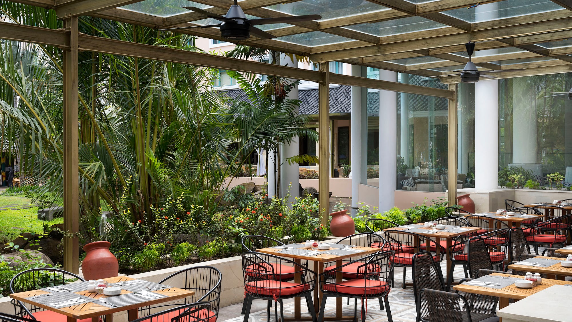 a patio with tables and chairs