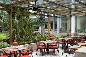 a patio with tables and chairs