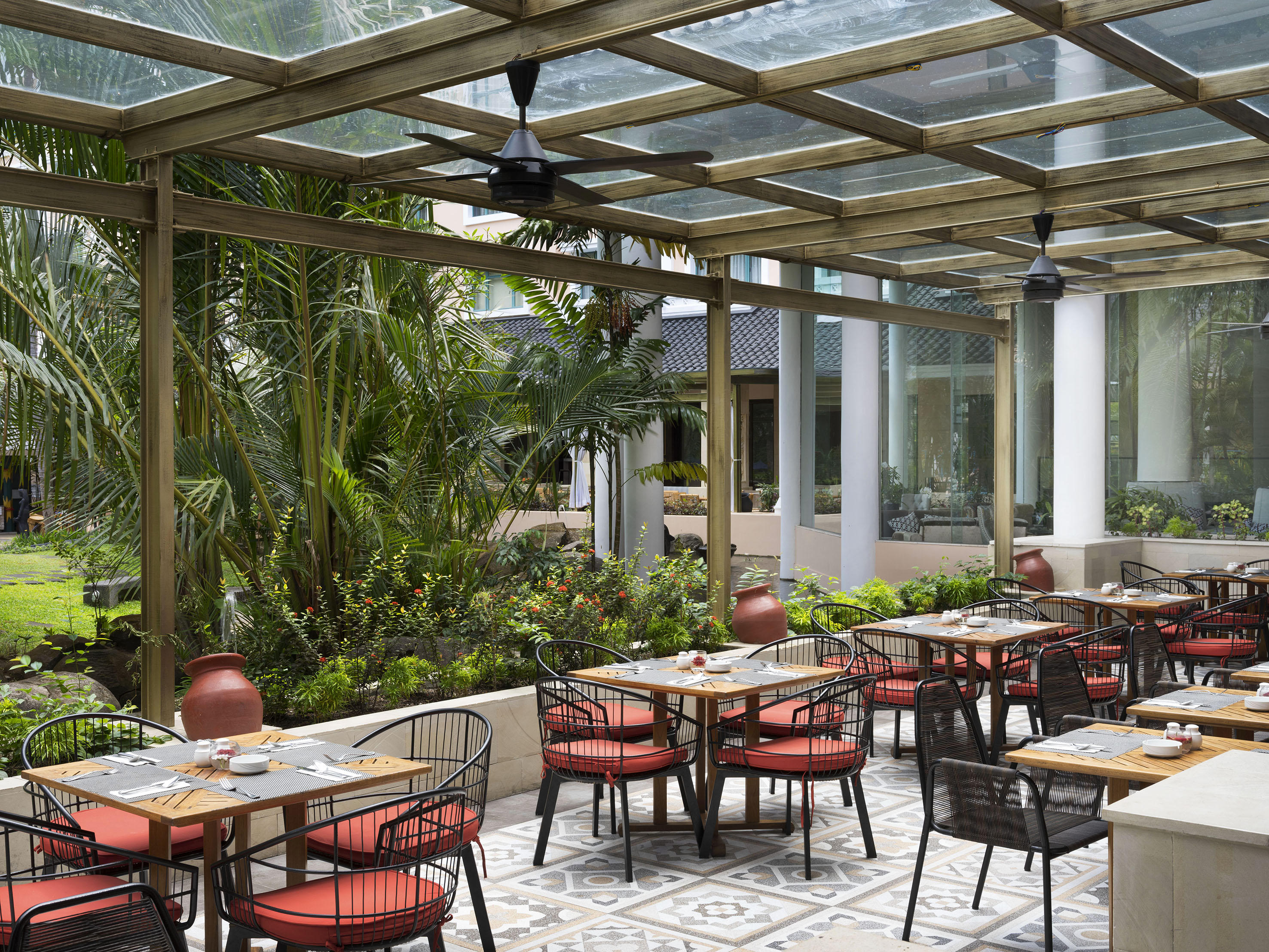 a patio with tables and chairs