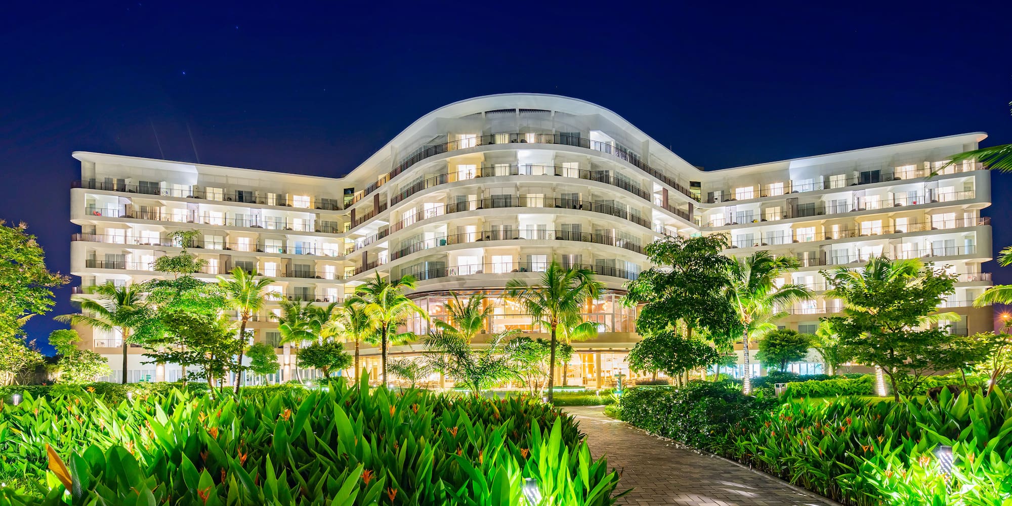 a building with trees and plants