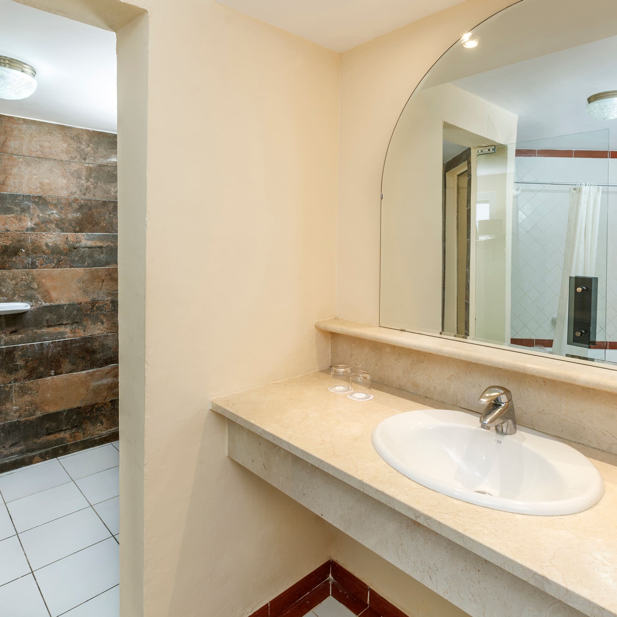 a bathroom with a large mirror