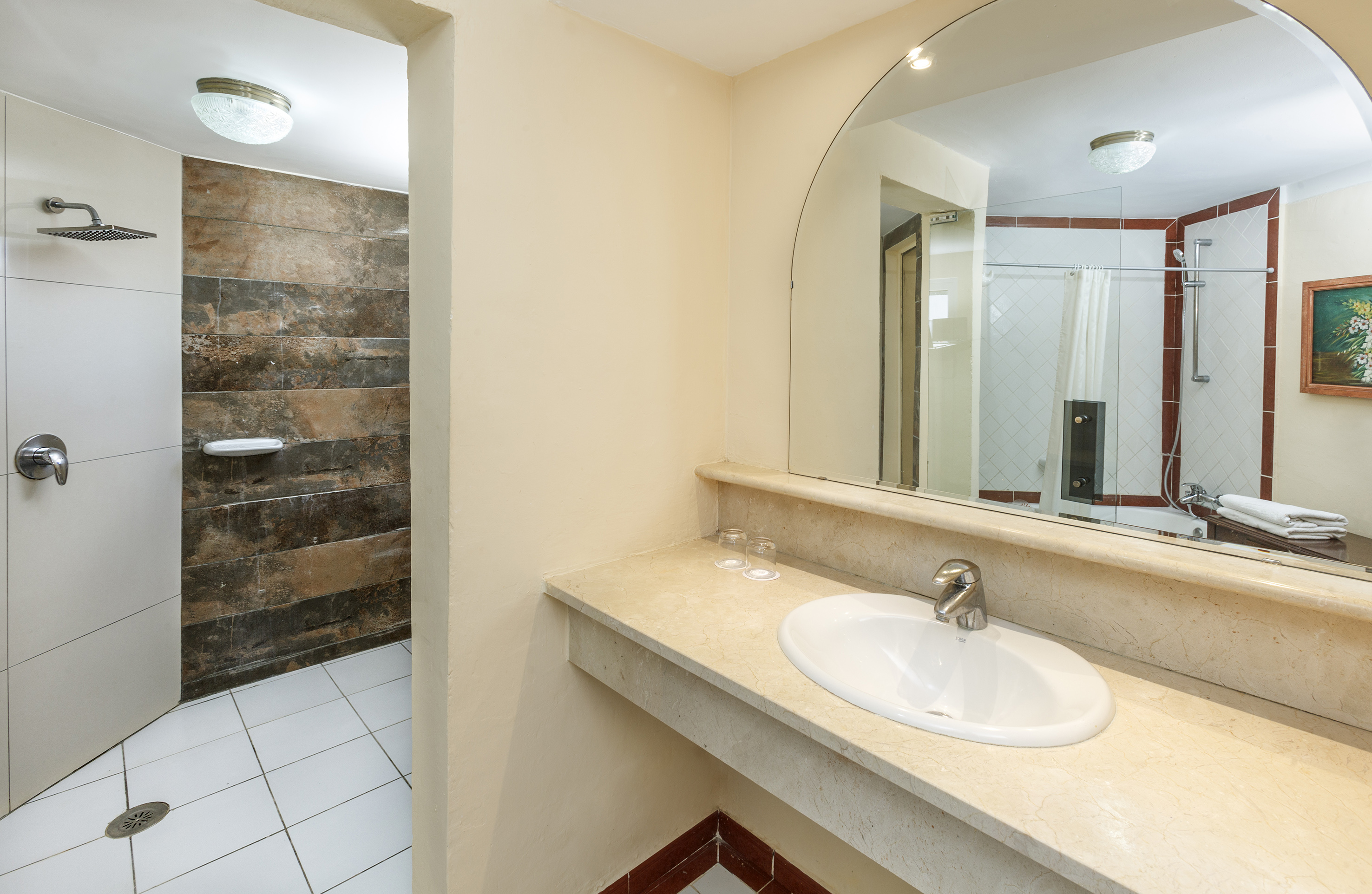 a bathroom with a large mirror