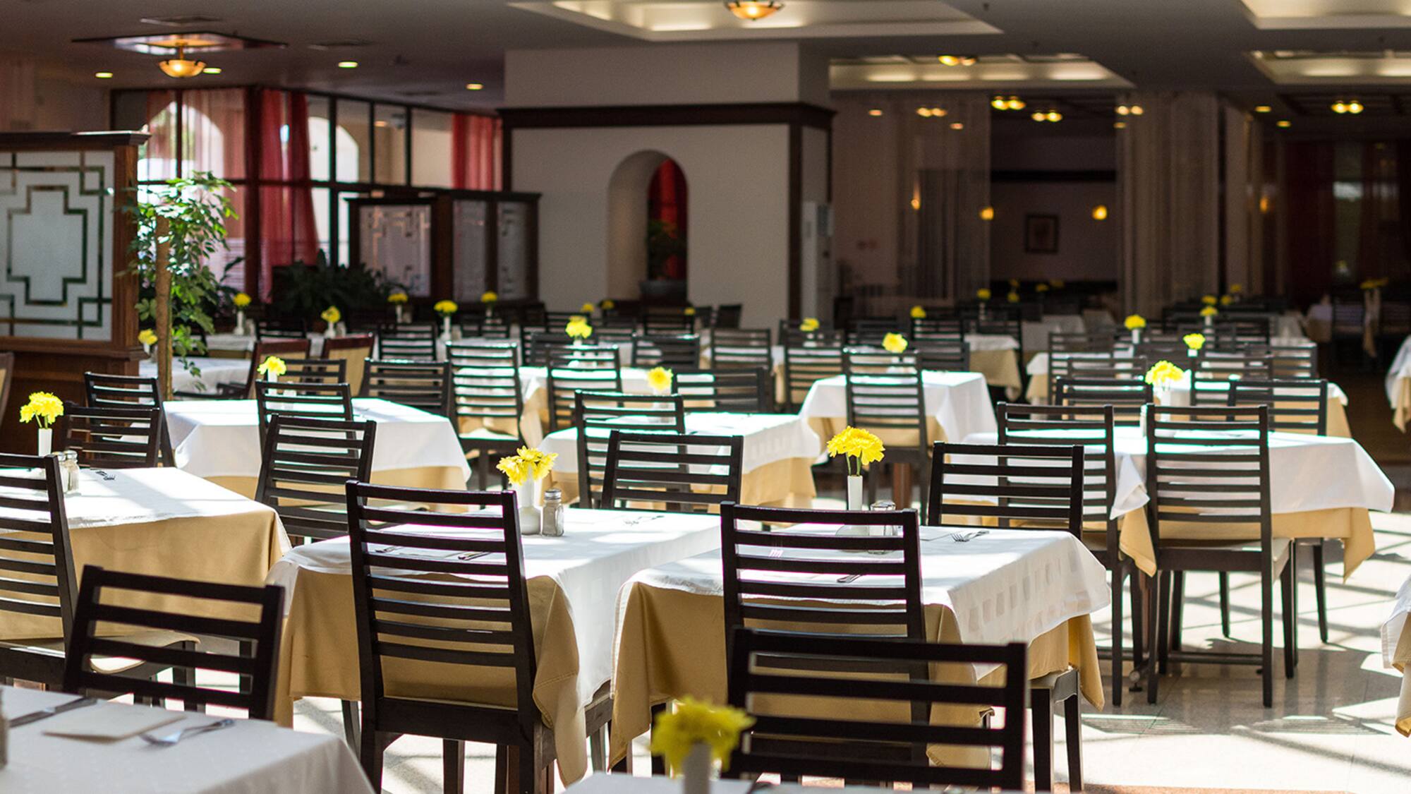 a room with tables and chairs