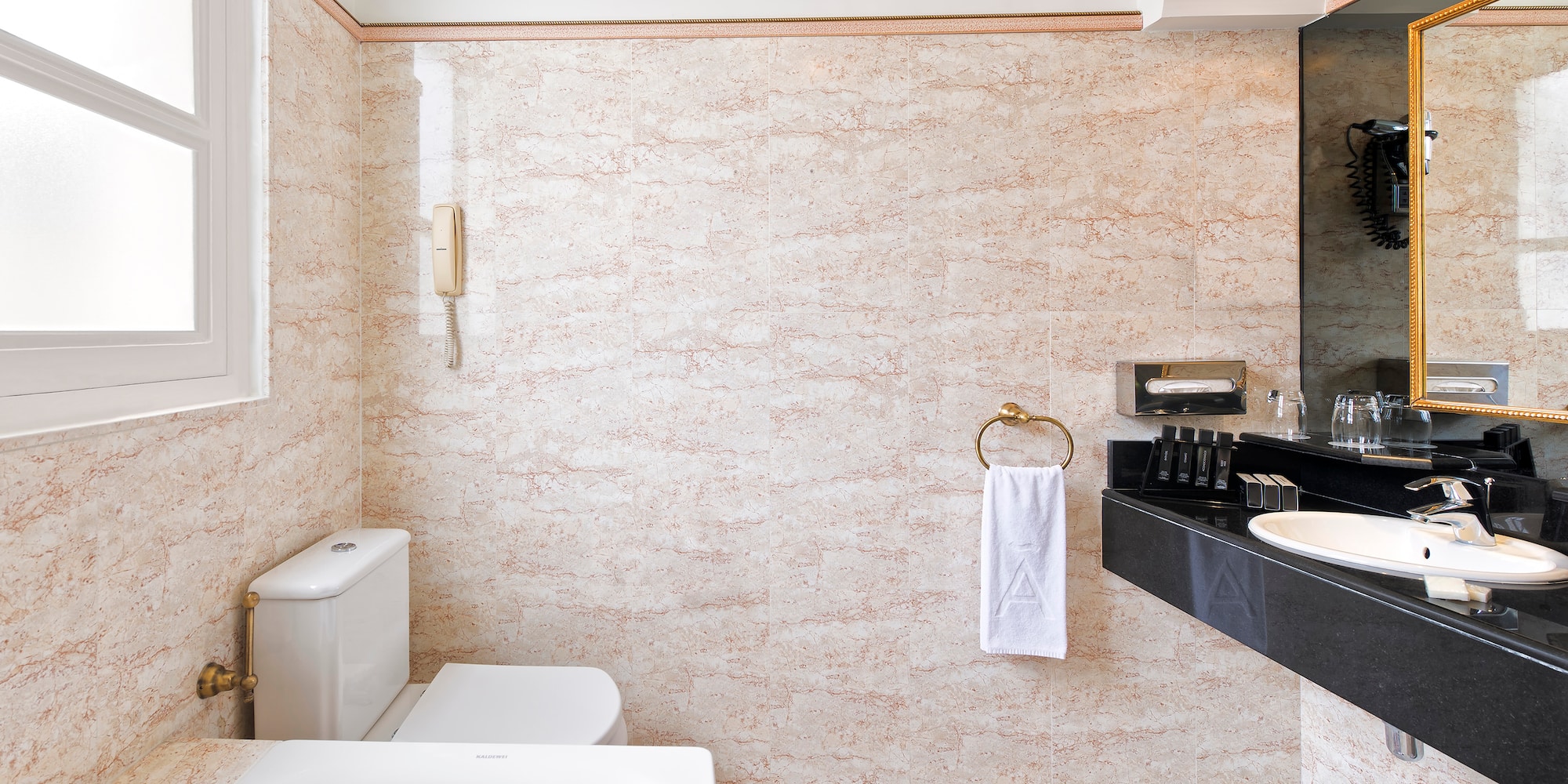 a bathroom with a sink toilet and toilet