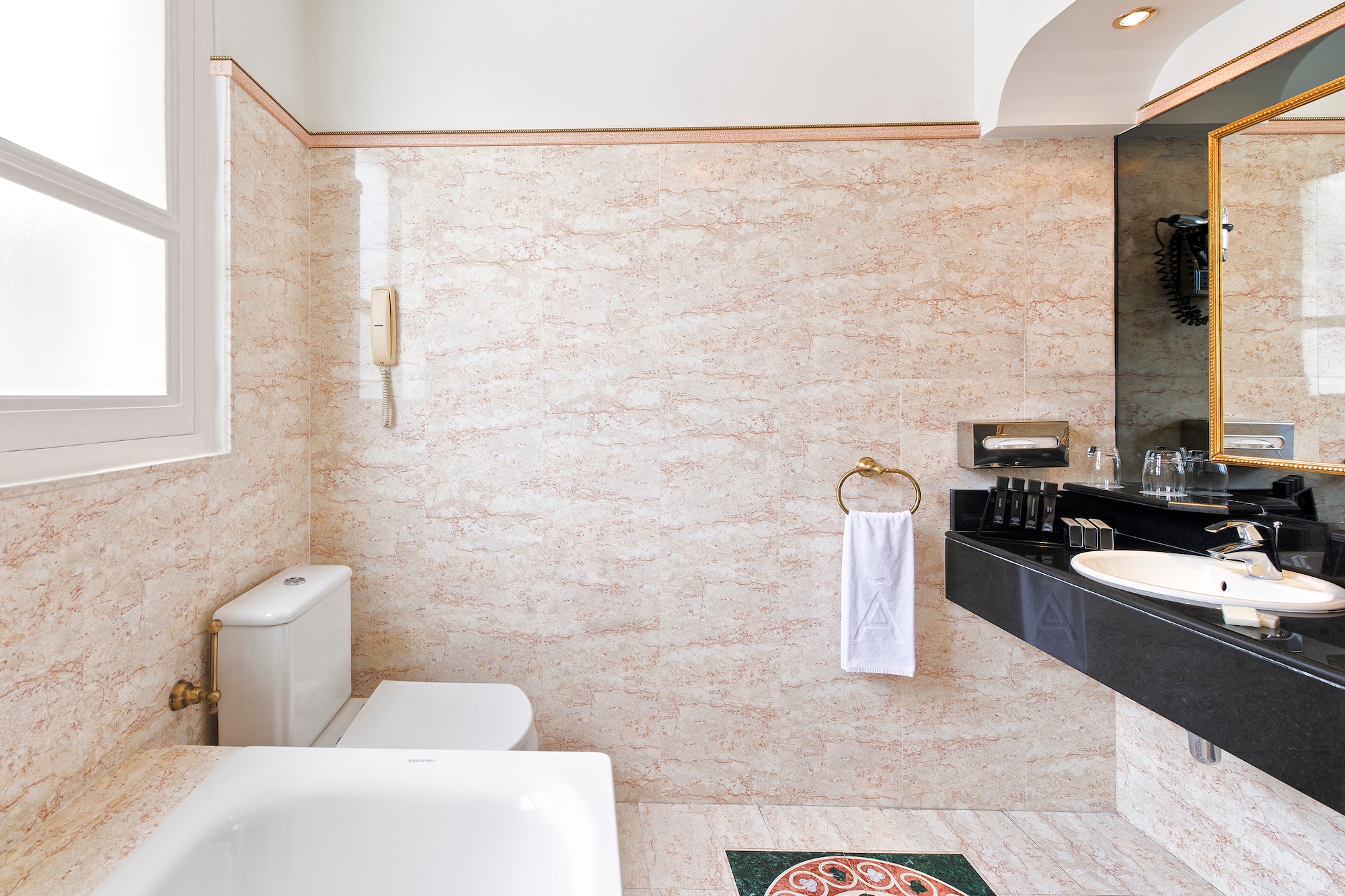 a bathroom with a sink toilet and toilet