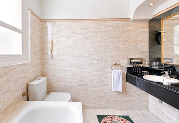 a bathroom with a sink toilet and toilet