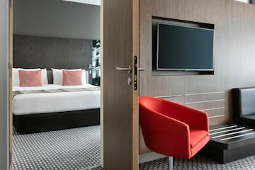 a room with a tv and a chair