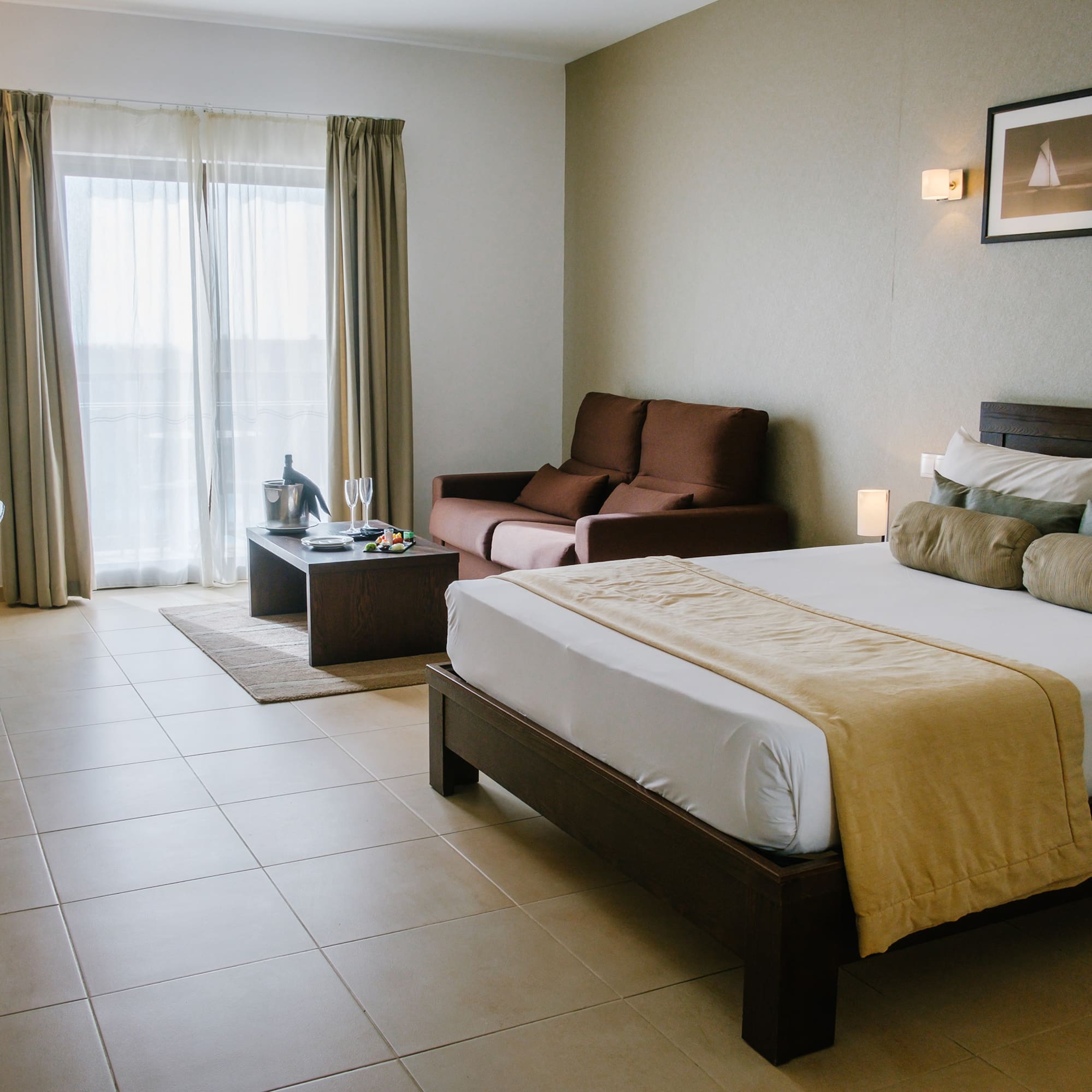 a bedroom with a bed and a couch