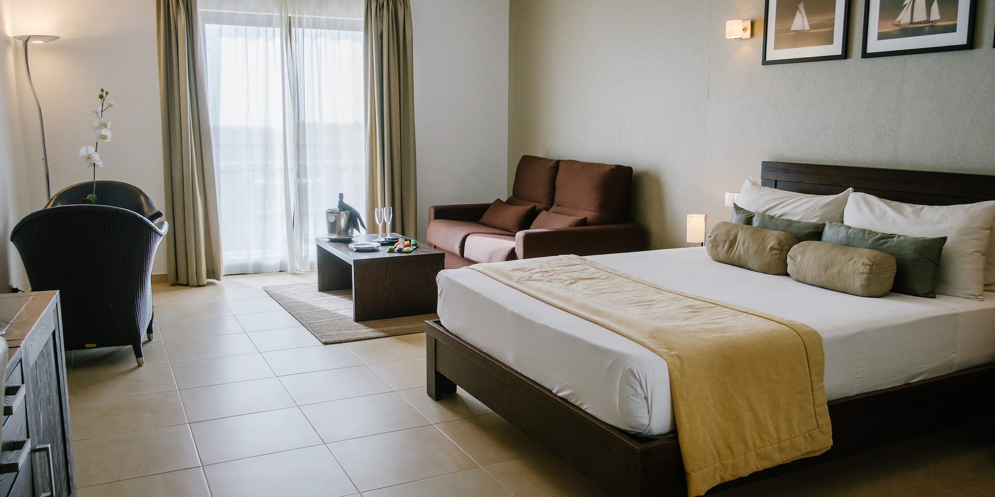 a bedroom with a bed and a couch