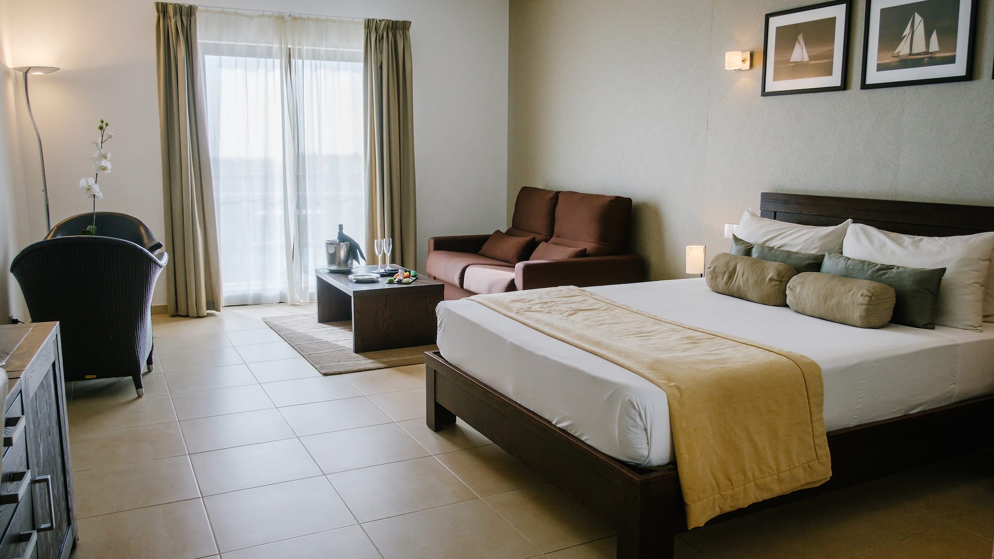 a bedroom with a bed and a couch