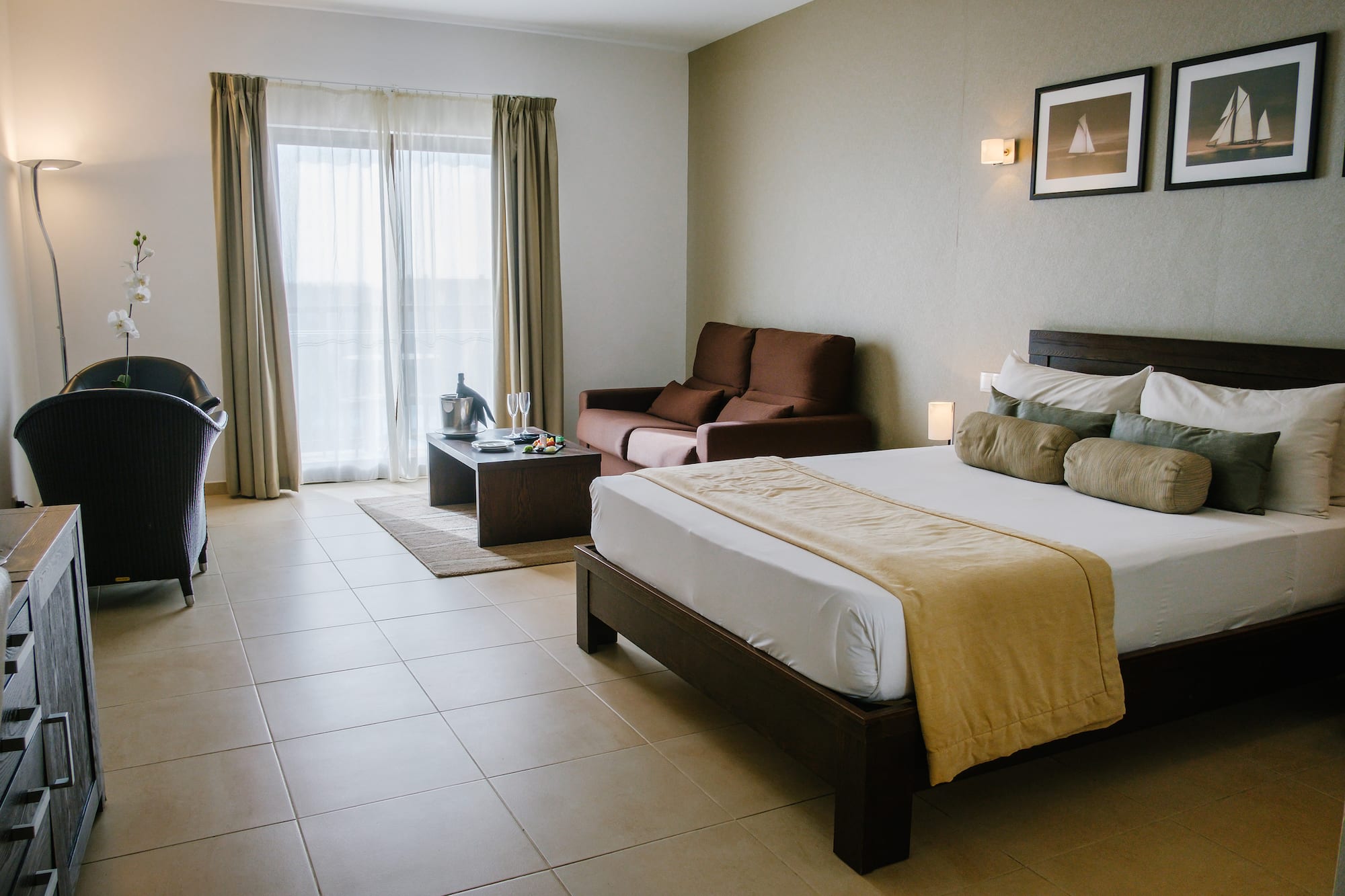 a bedroom with a bed and a couch