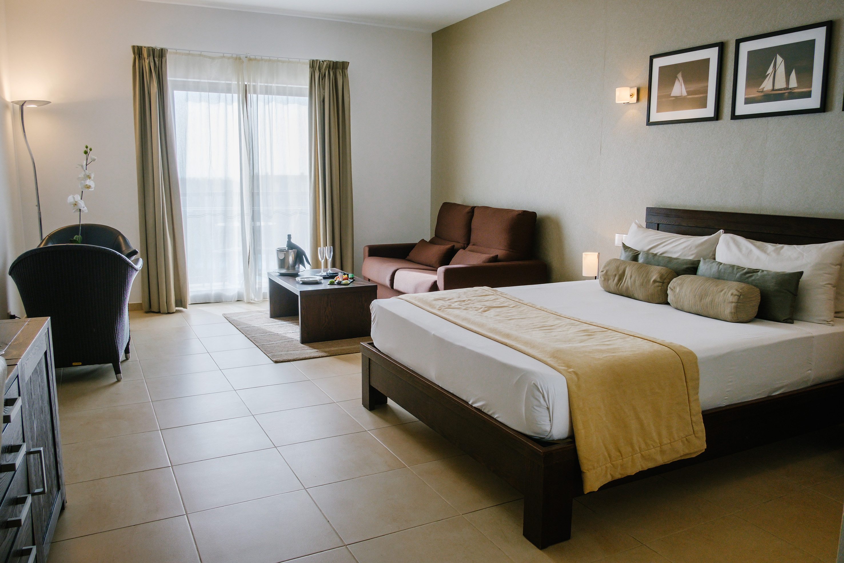 a bedroom with a bed and a couch