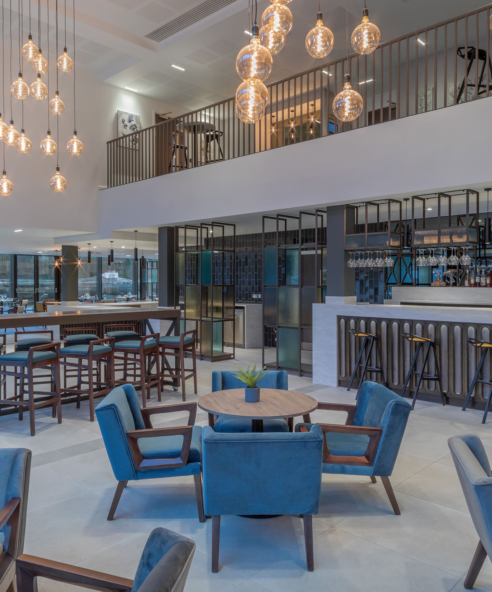 a room with a bar and chairs