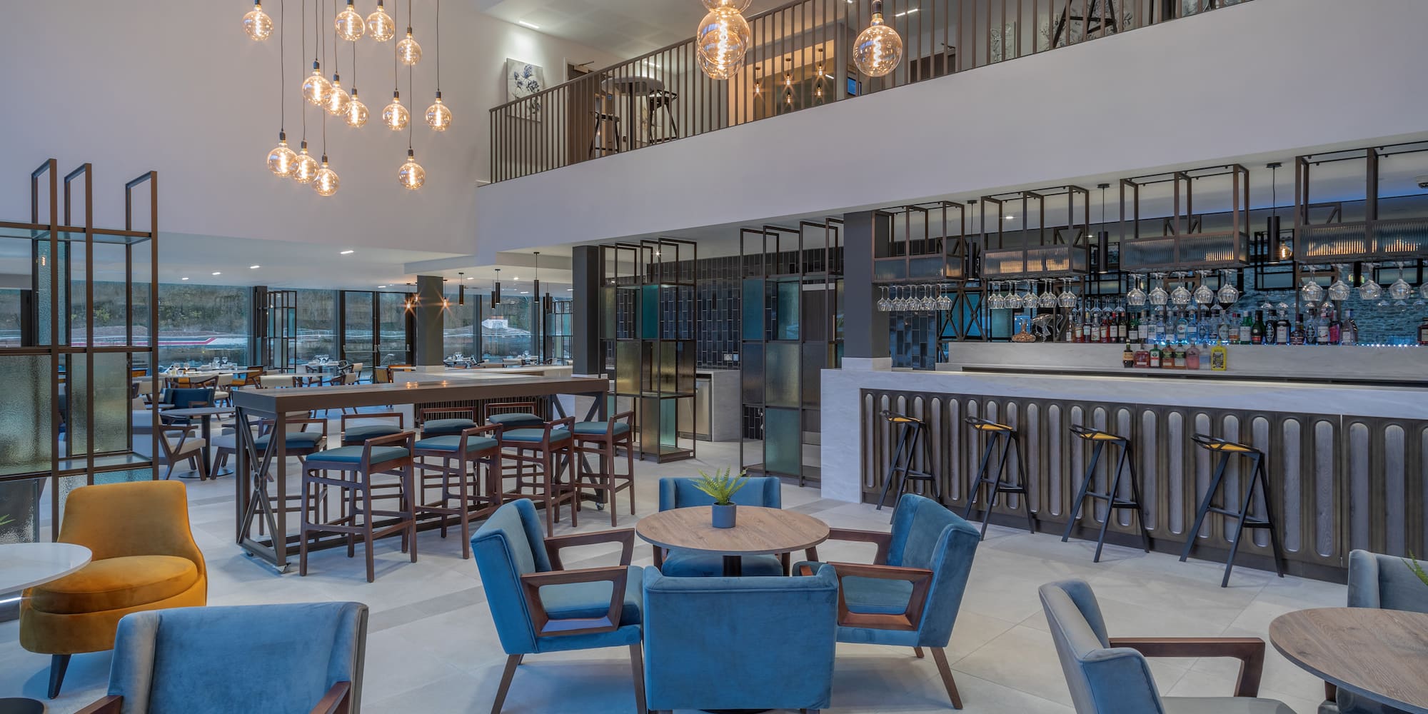 a room with a bar and chairs