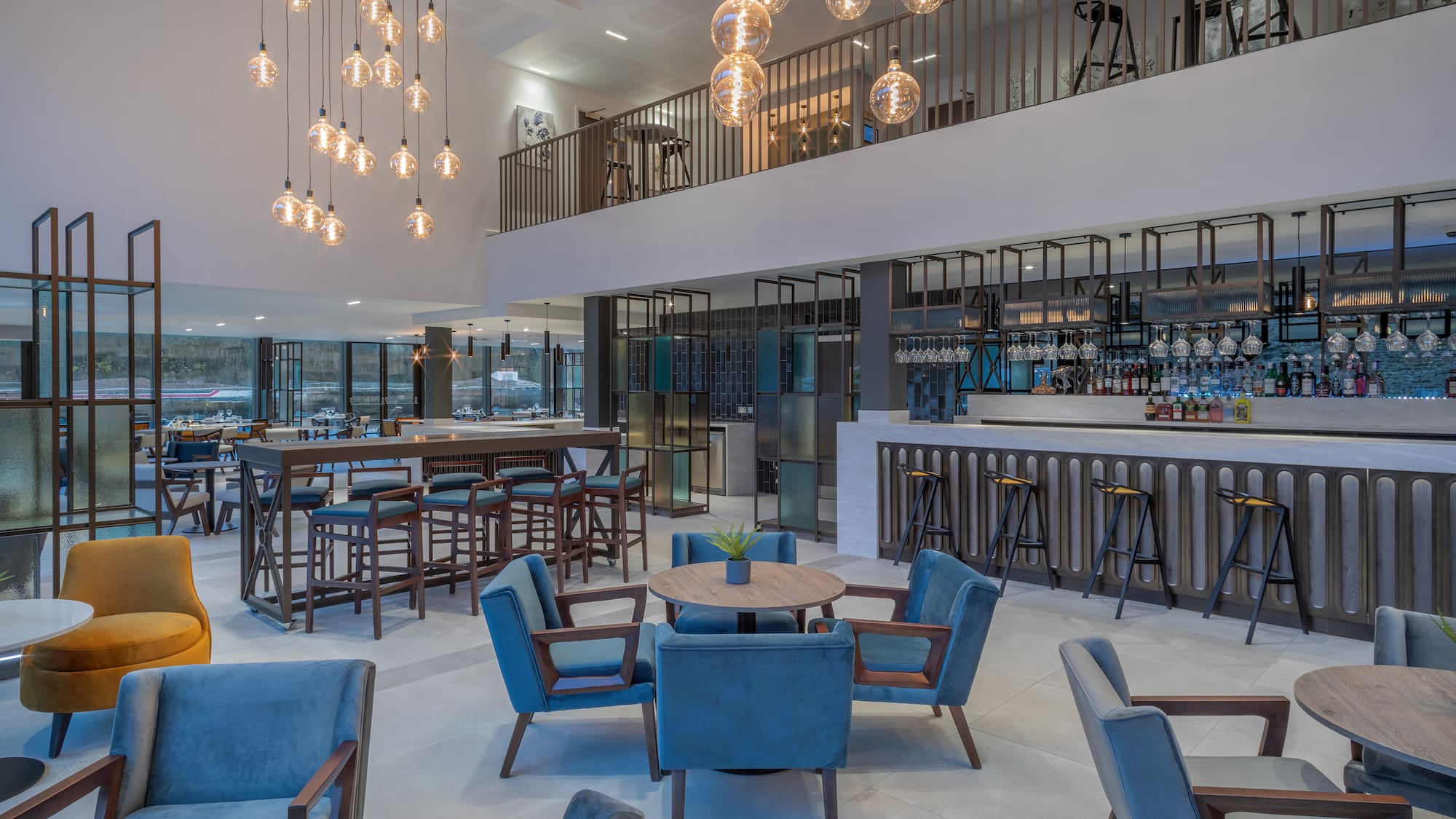 a room with a bar and chairs