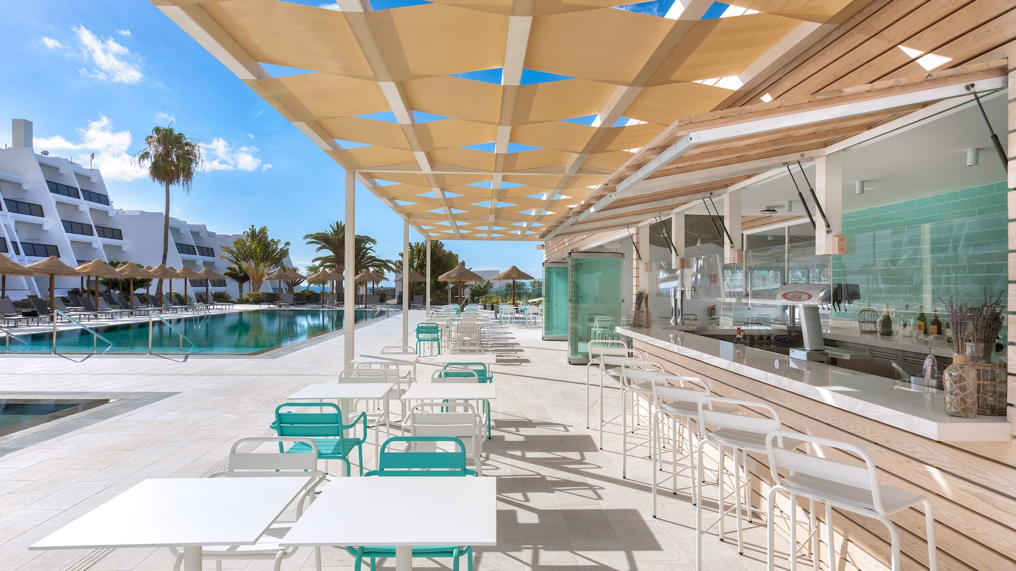 a pool with tables and chairs