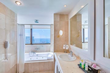 a bathroom with a bathtub and a sink