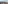 Panoramic Madrid cityscape with red tile rooftops, church spires, and blue sky.