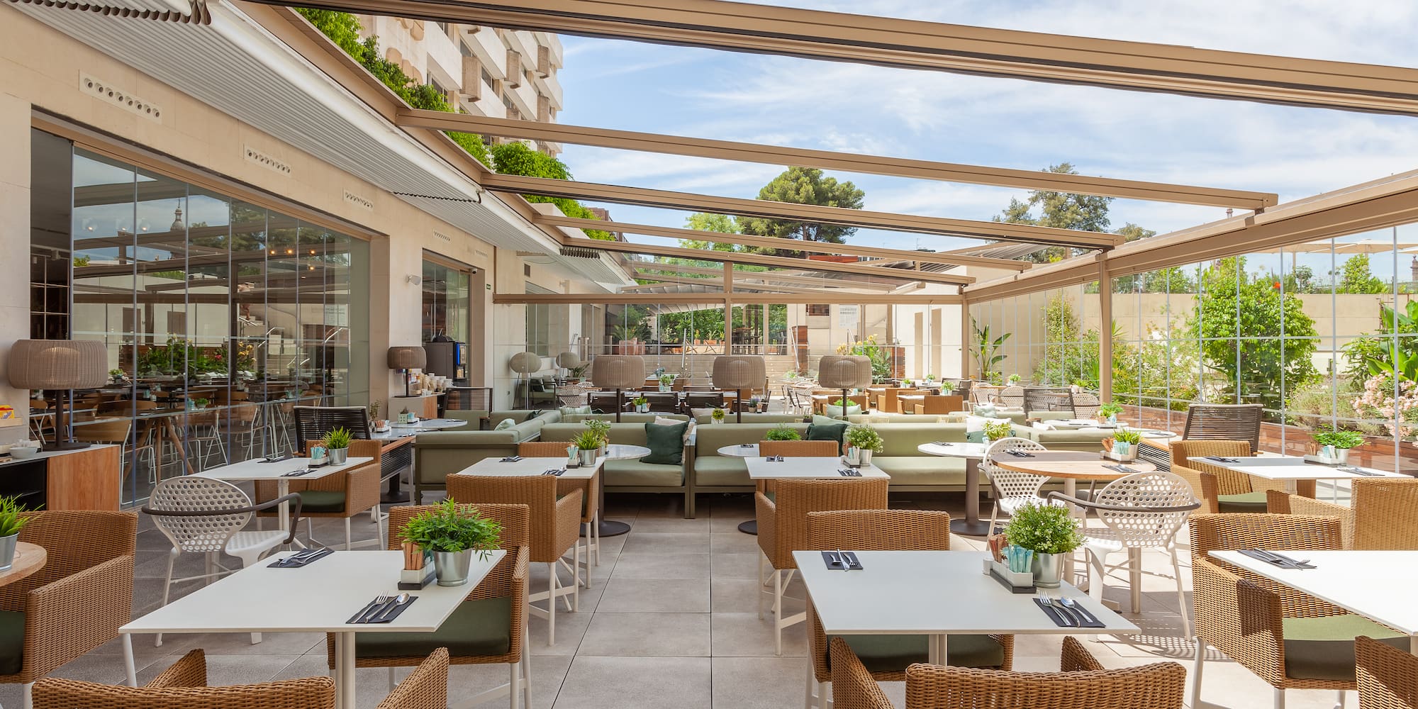 a patio with tables and chairs