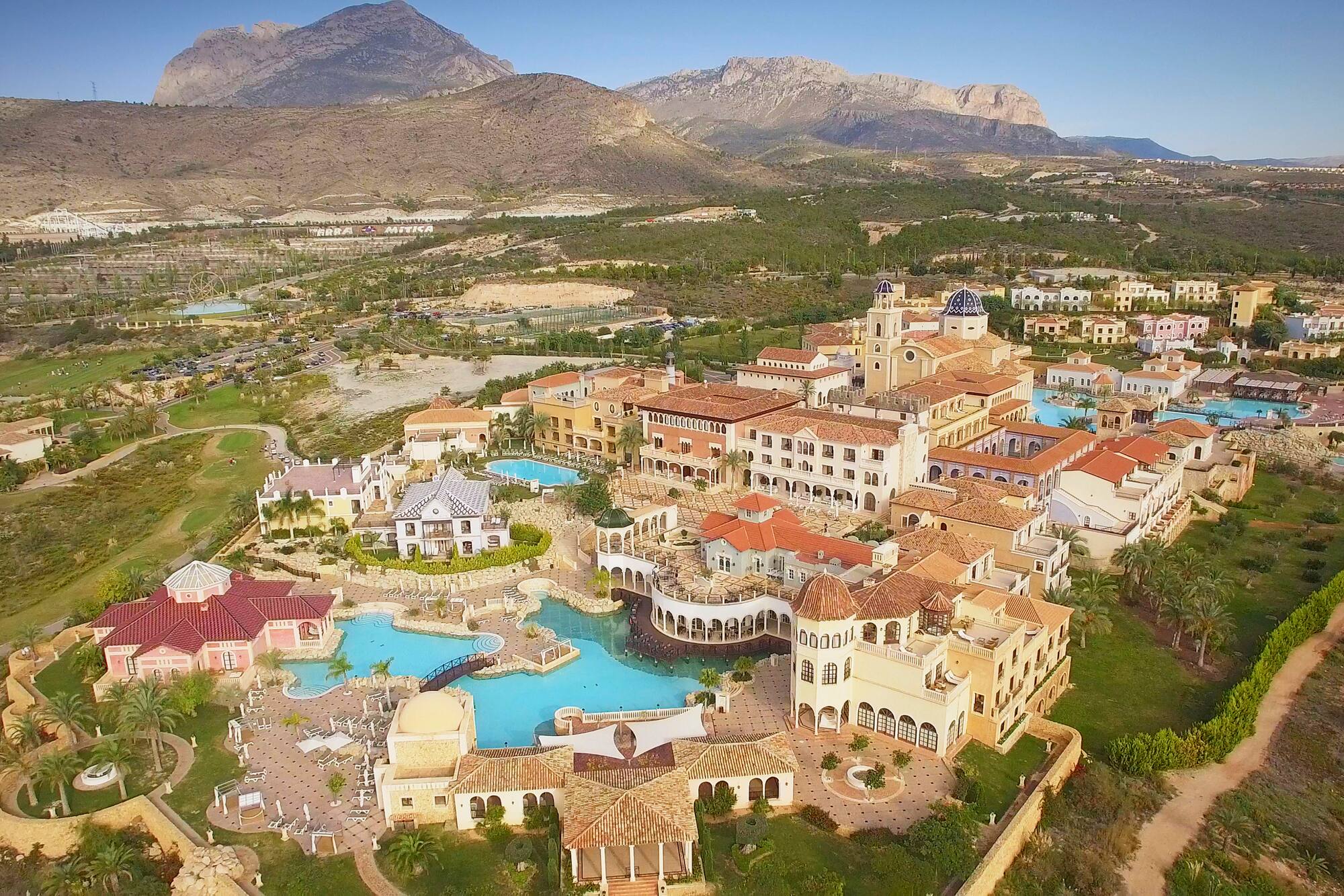 Mediterranean resort, pools, Spanish architecture, mountains, Terra Mitica.