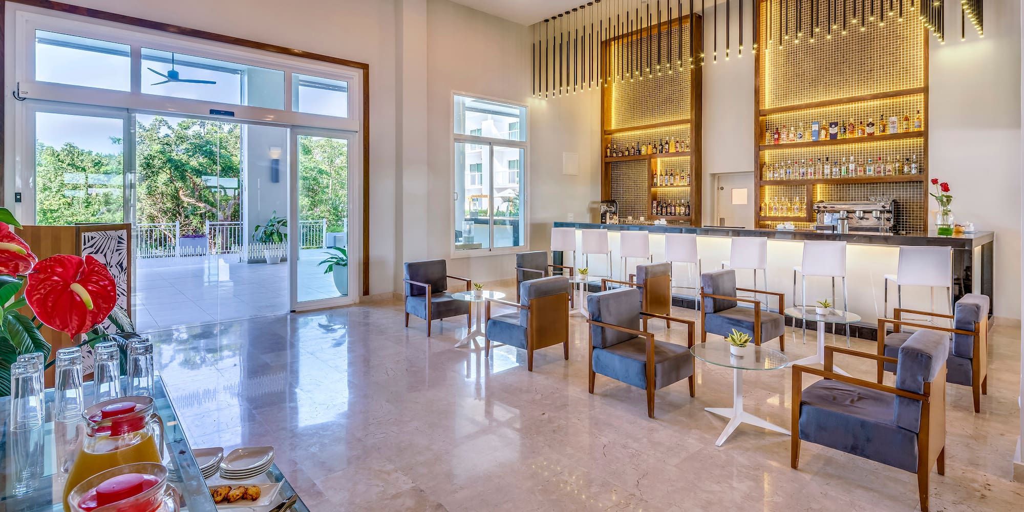 a room with a bar and chairs