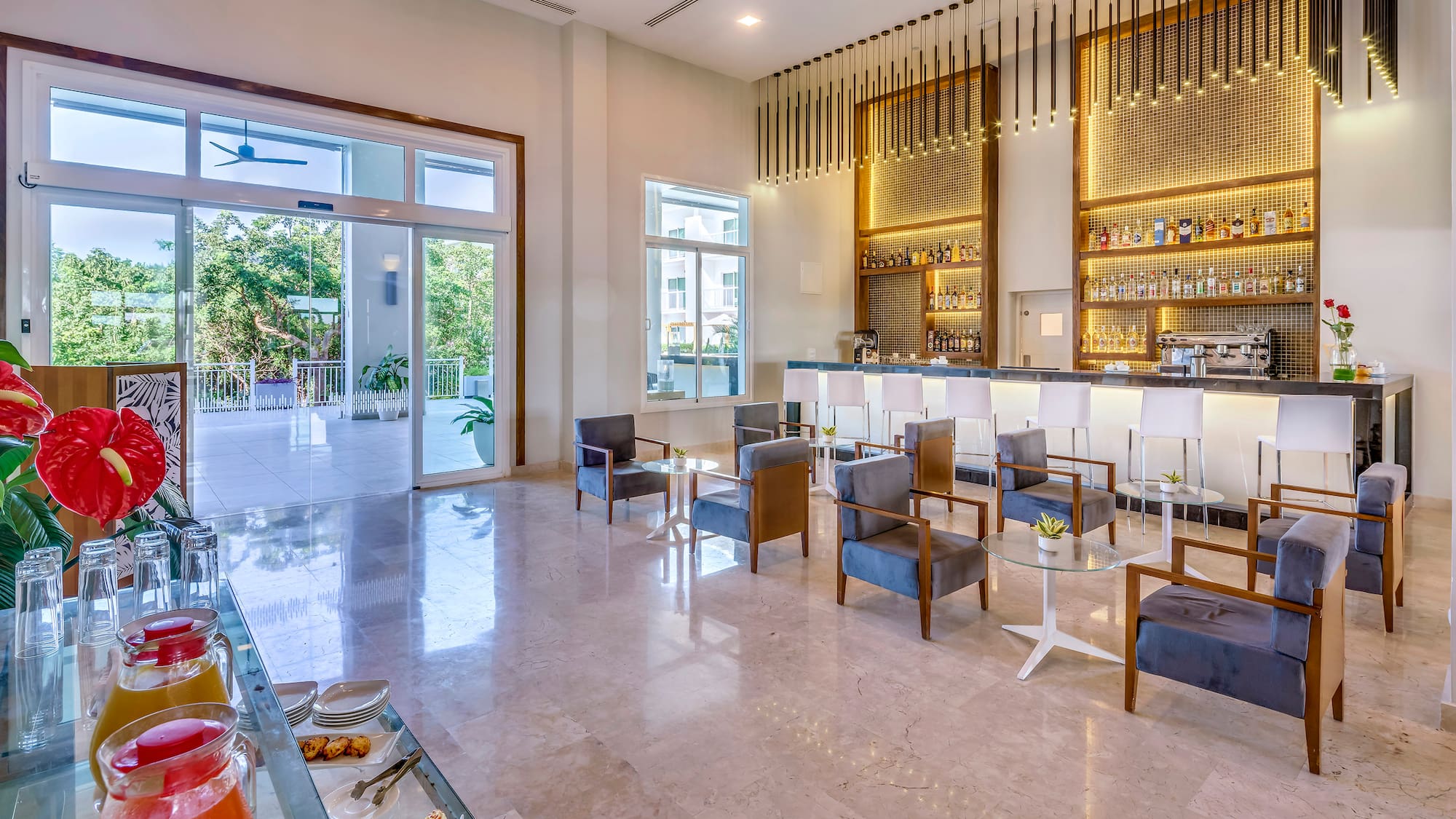 a room with a bar and chairs