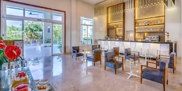 a room with a bar and chairs