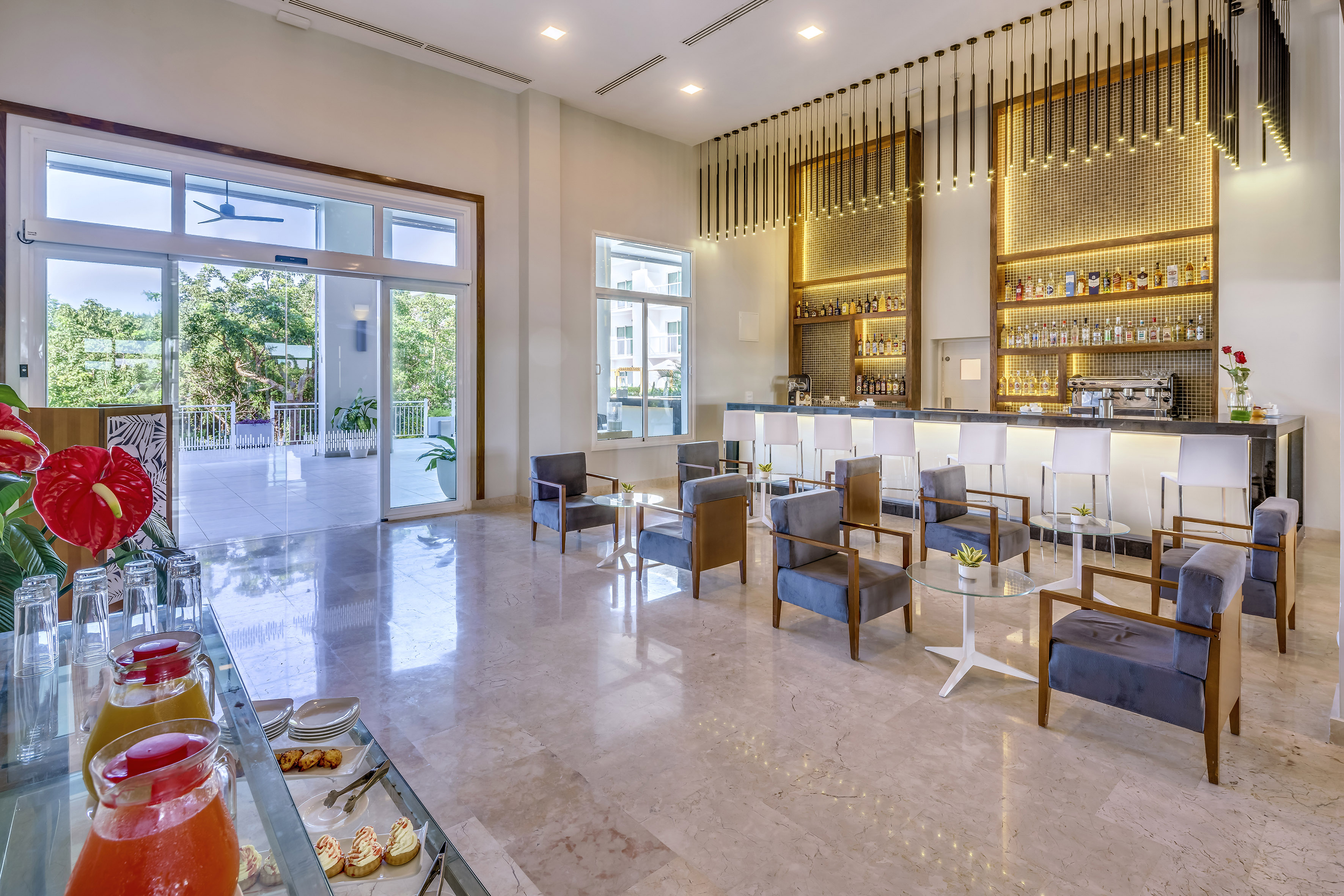 a room with a bar and chairs