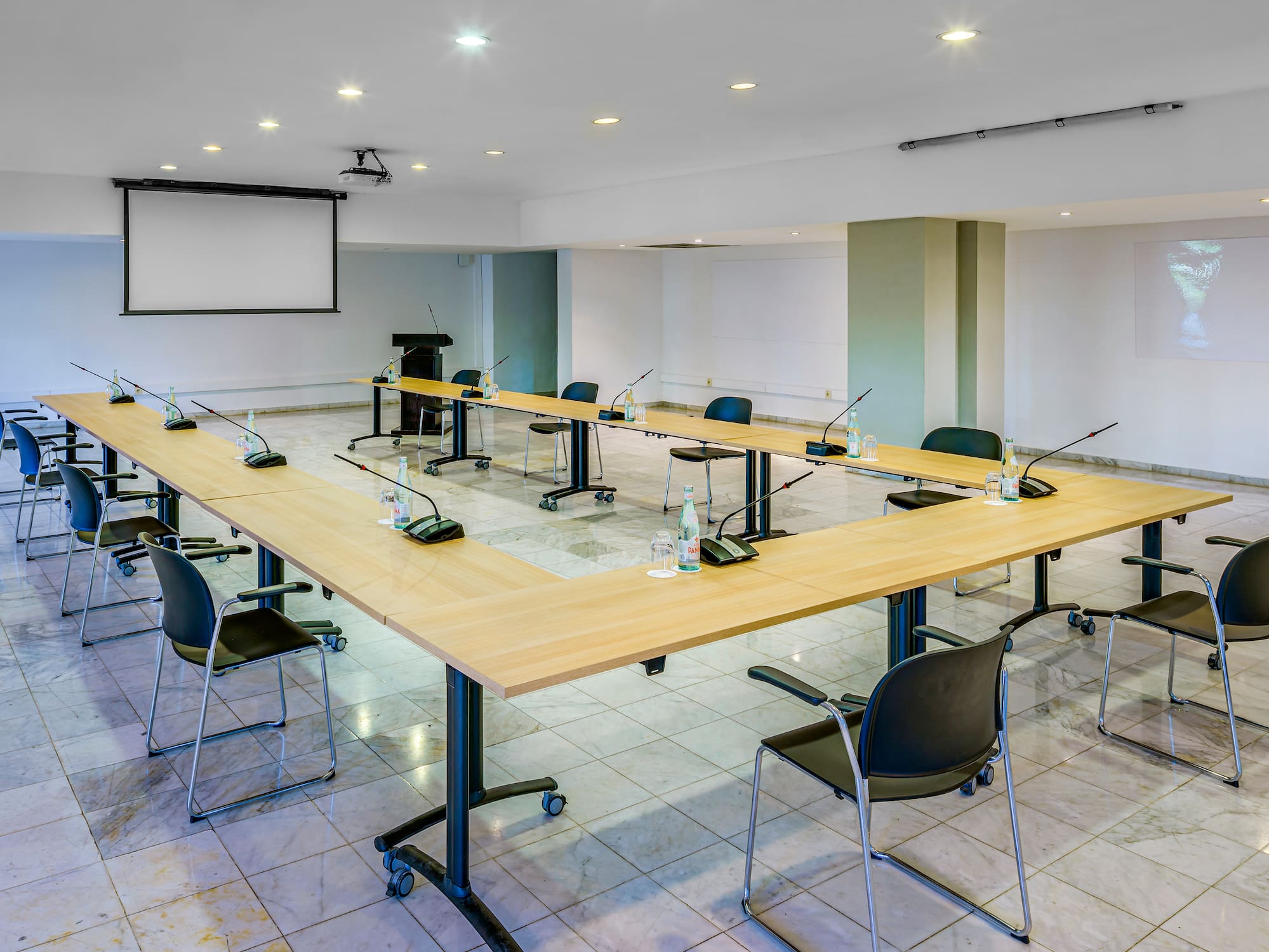 a room with a large table and chairs