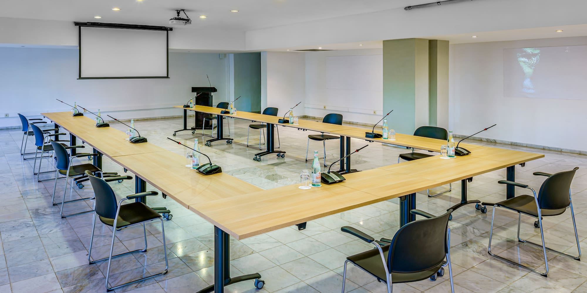 a room with a large table and chairs