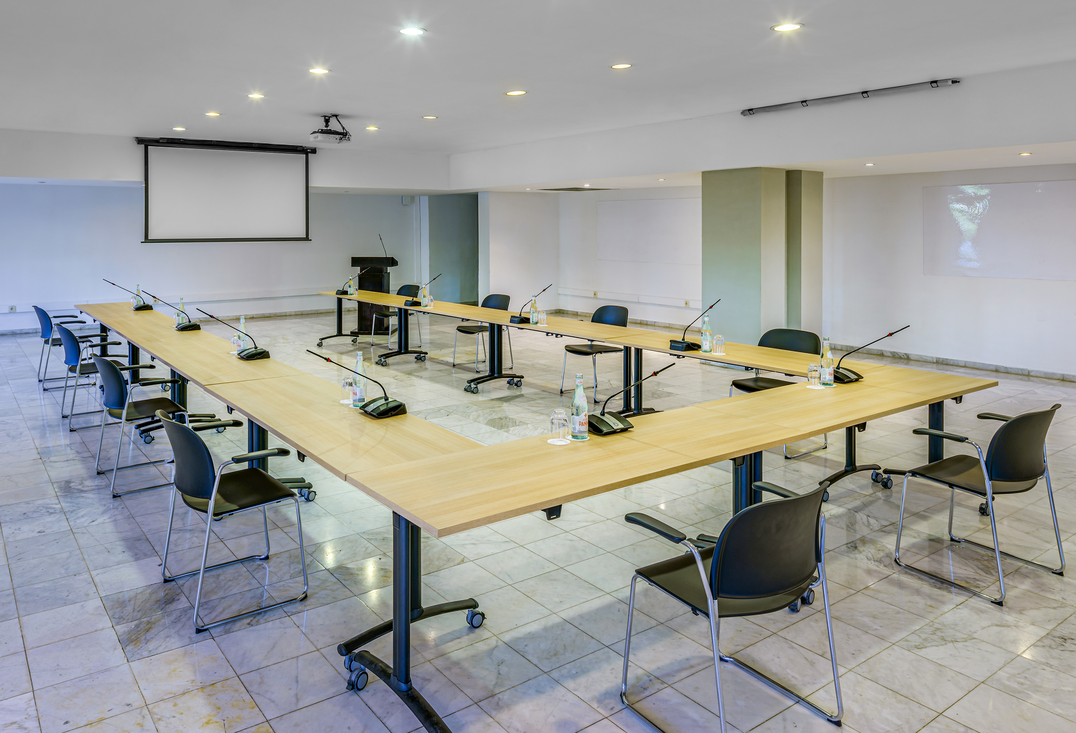 a room with a large table and chairs