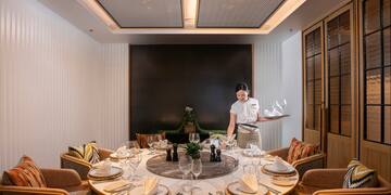 a woman serving a table