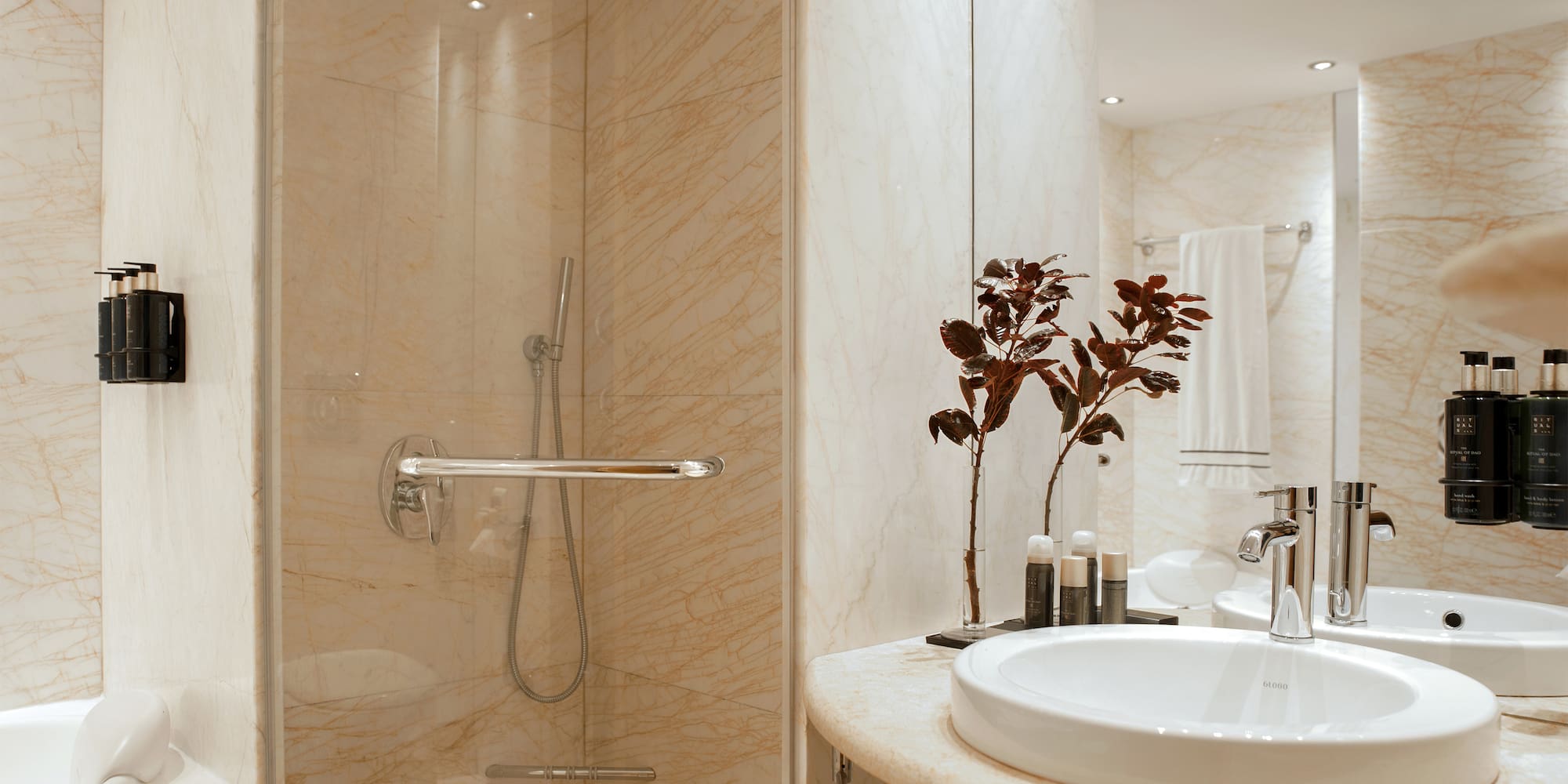 a bathroom with a sink and shower