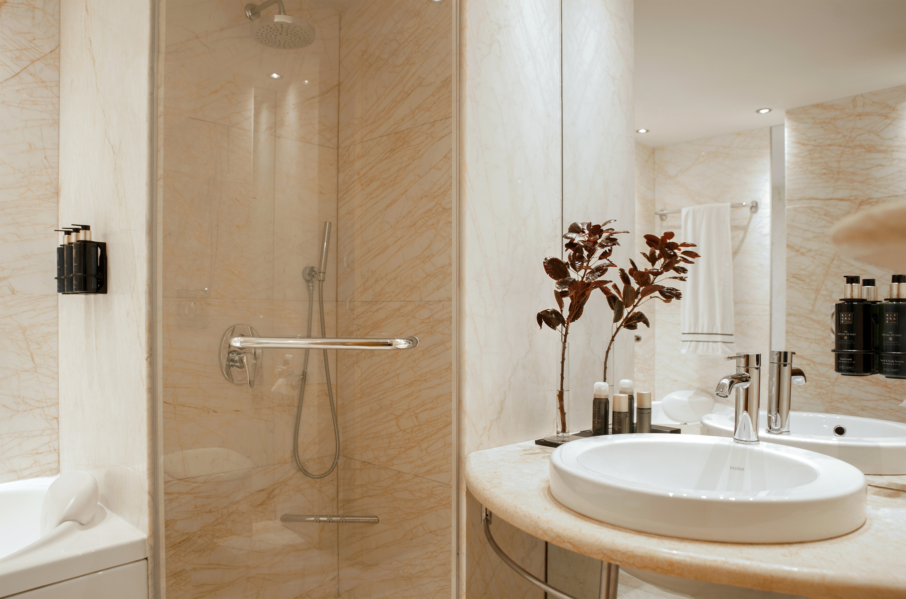 a bathroom with a sink and shower