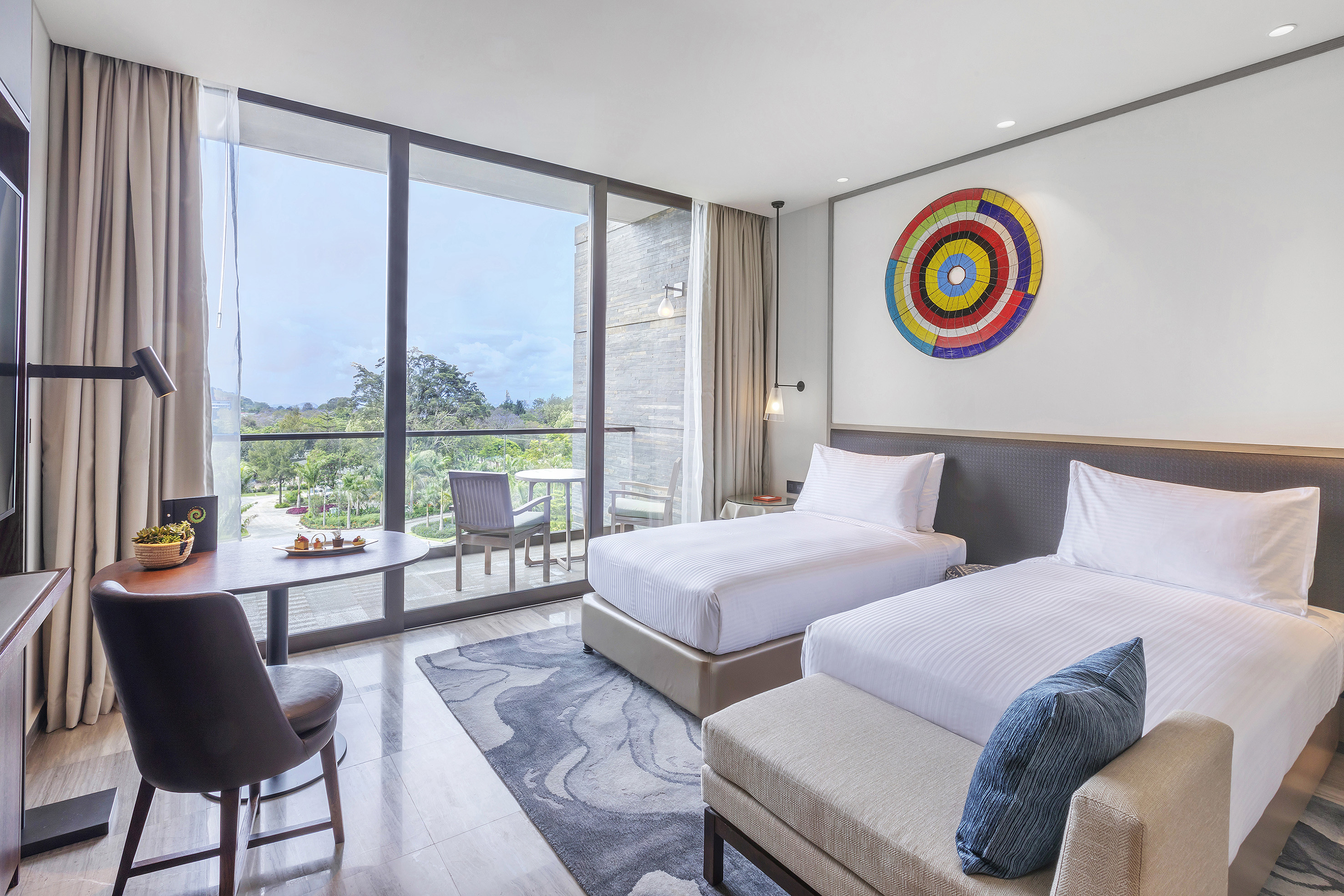 a room with two beds and a table