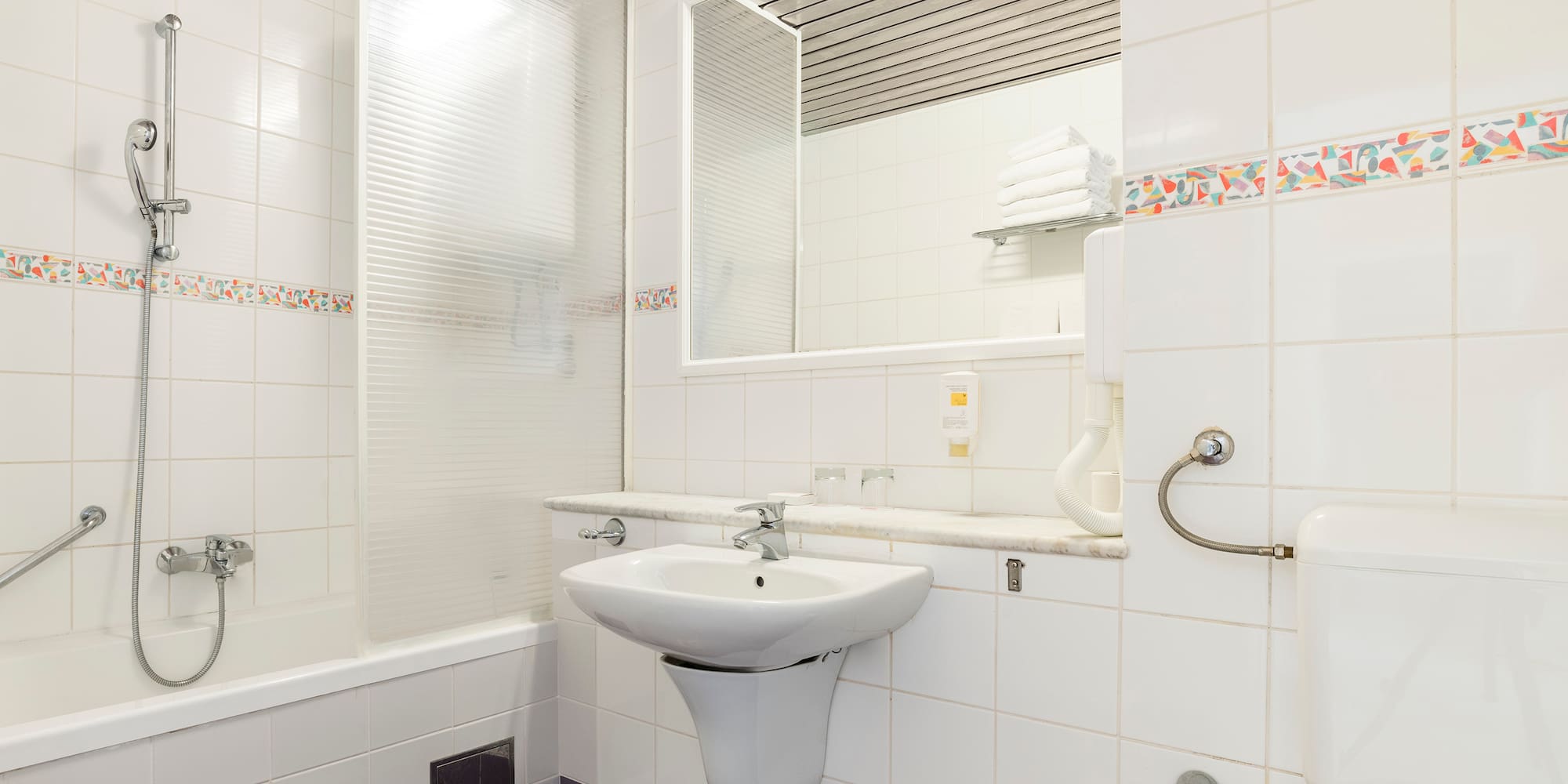 a bathroom with a sink and mirror