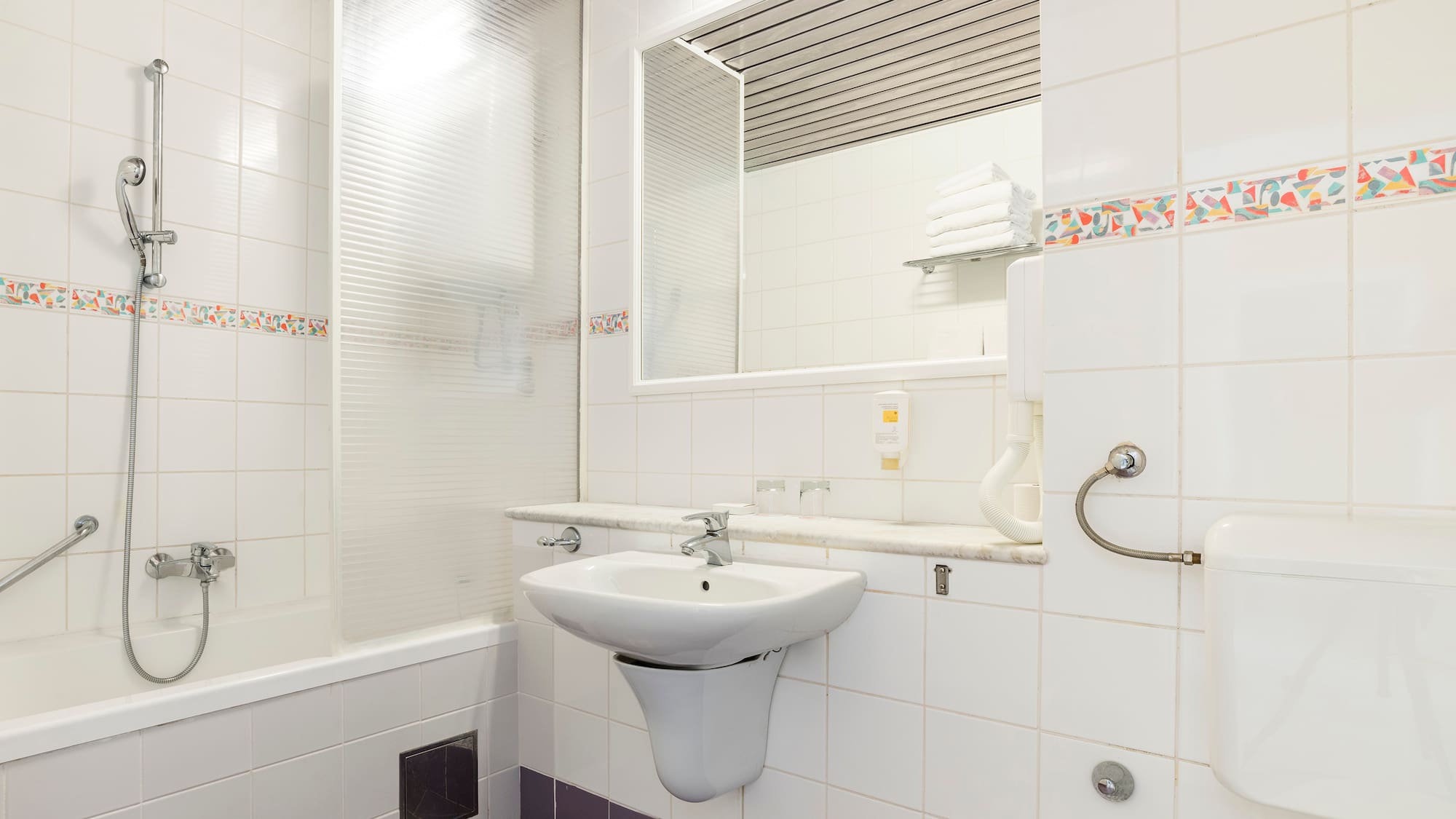 a bathroom with a sink and mirror