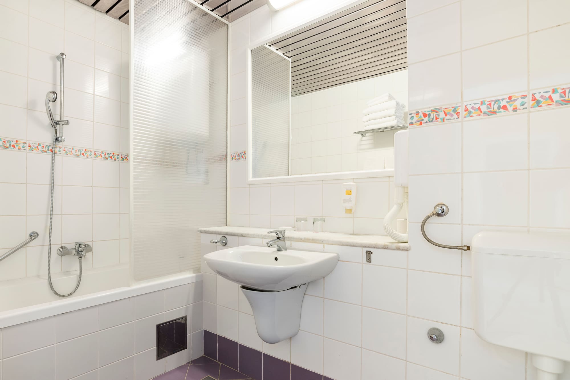 a bathroom with a sink and mirror
