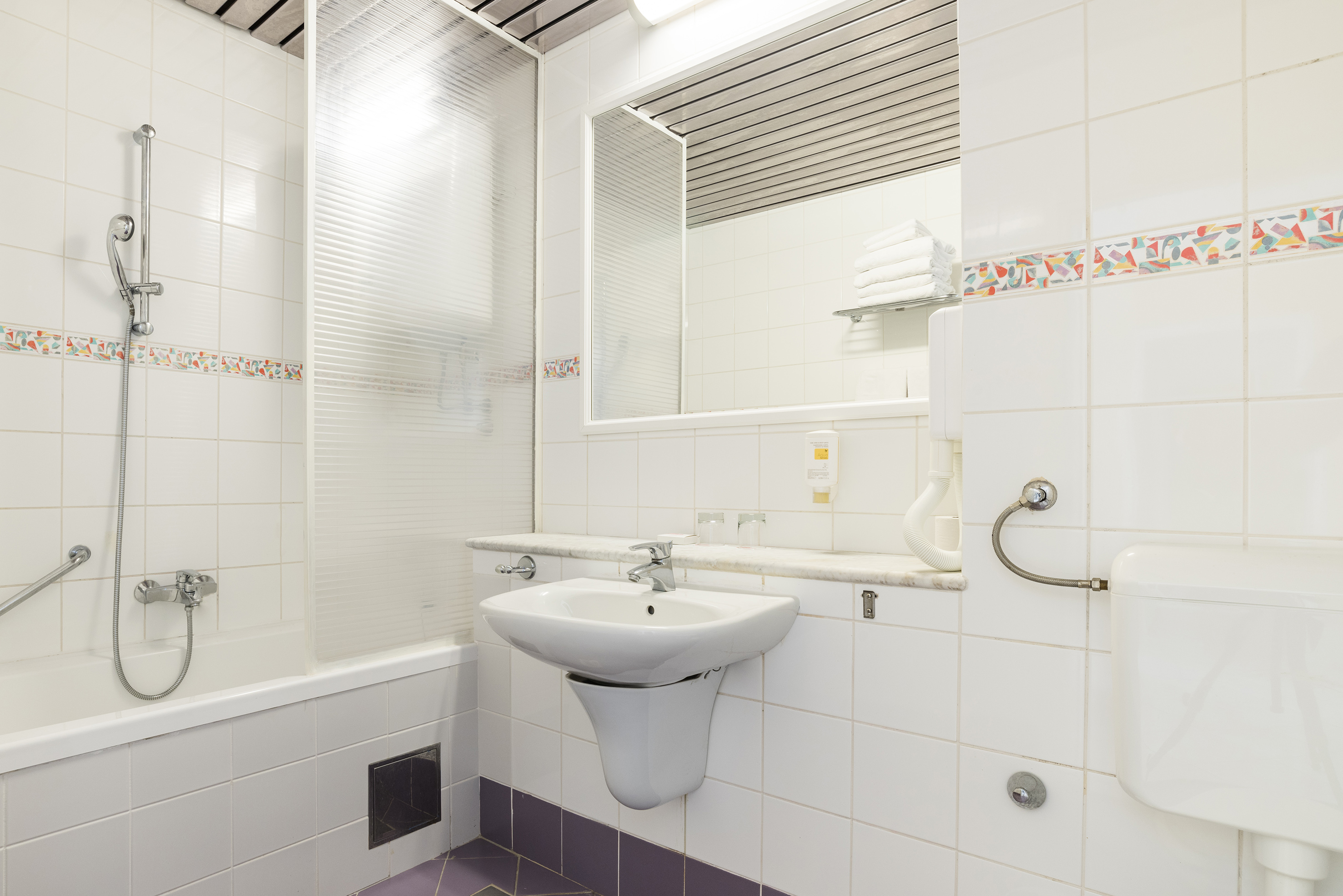 a bathroom with a sink and mirror