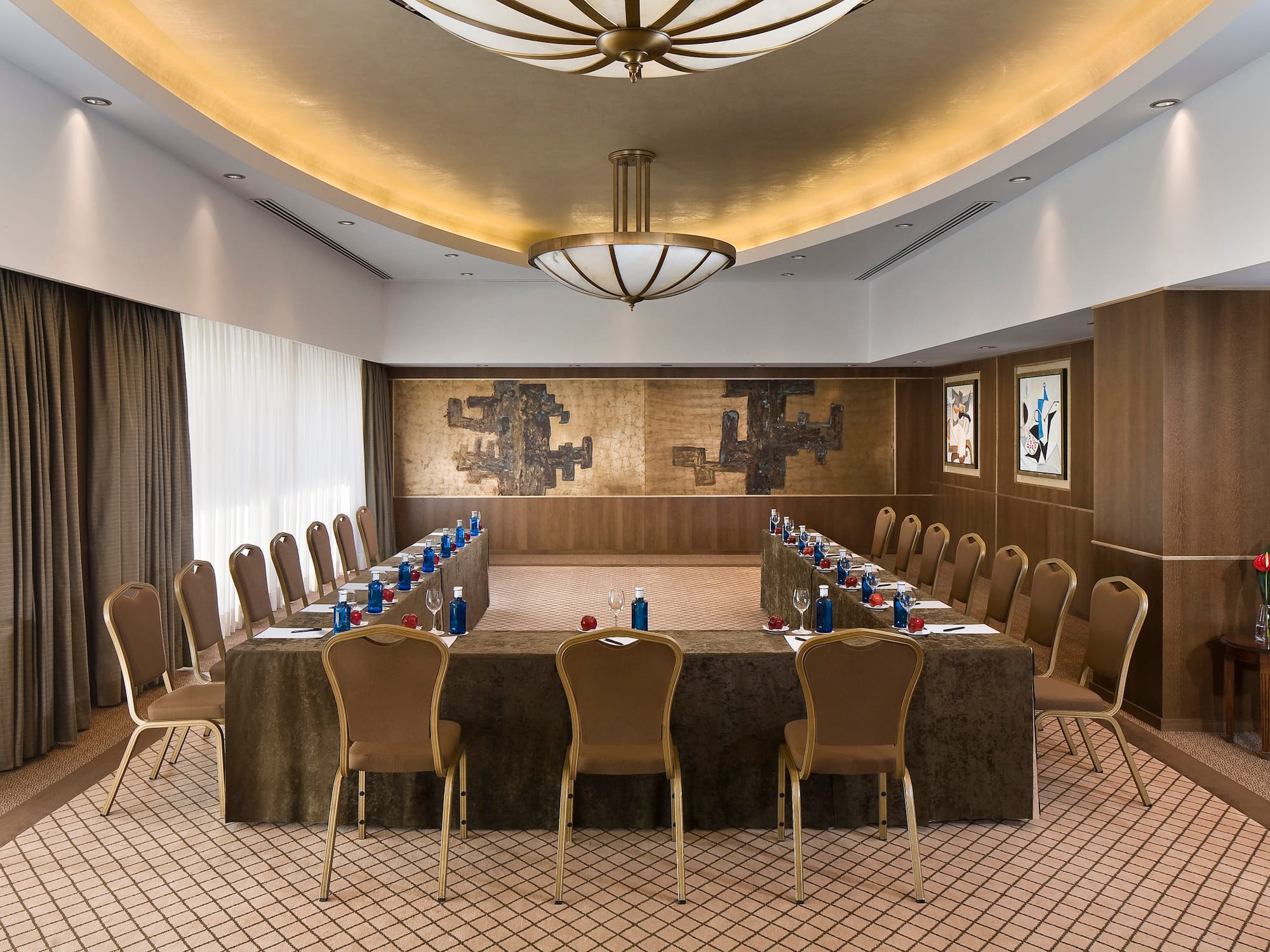 a room with a long table and chairs