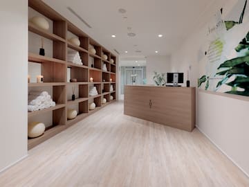 a room with shelves and a desk
