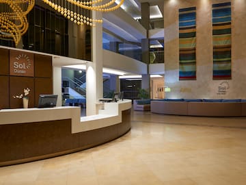a lobby with a reception desk and a couch