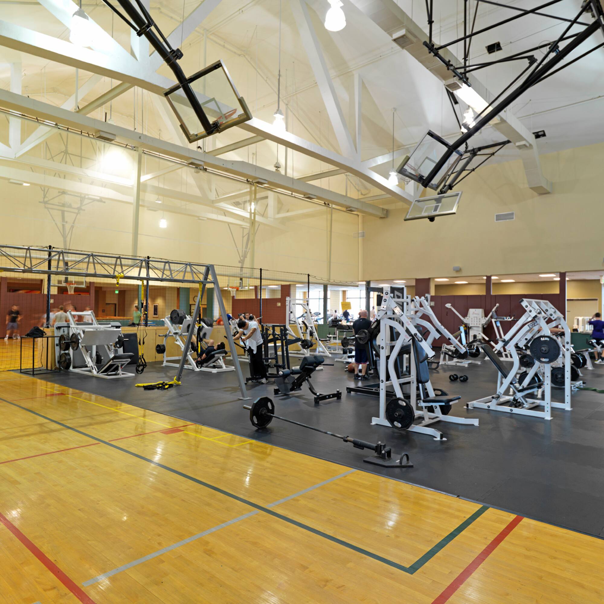 a gym with many exercise equipment