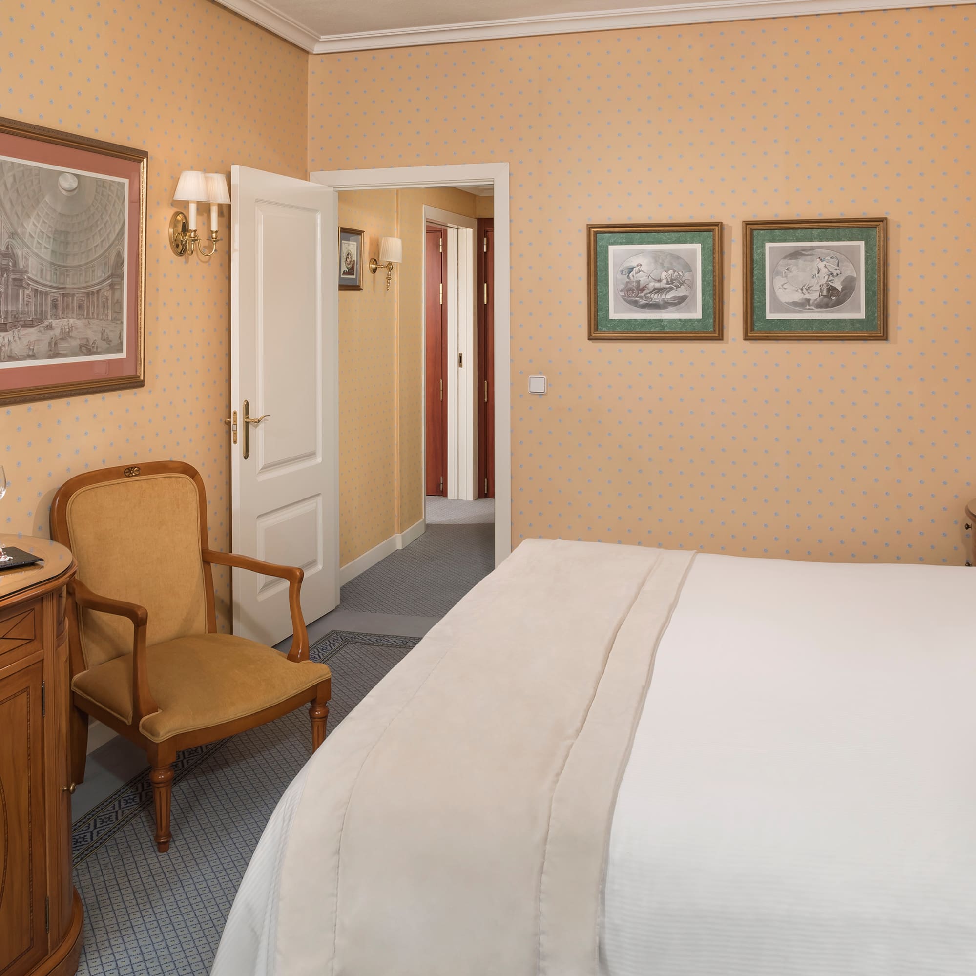 a bedroom with a bed and a chair