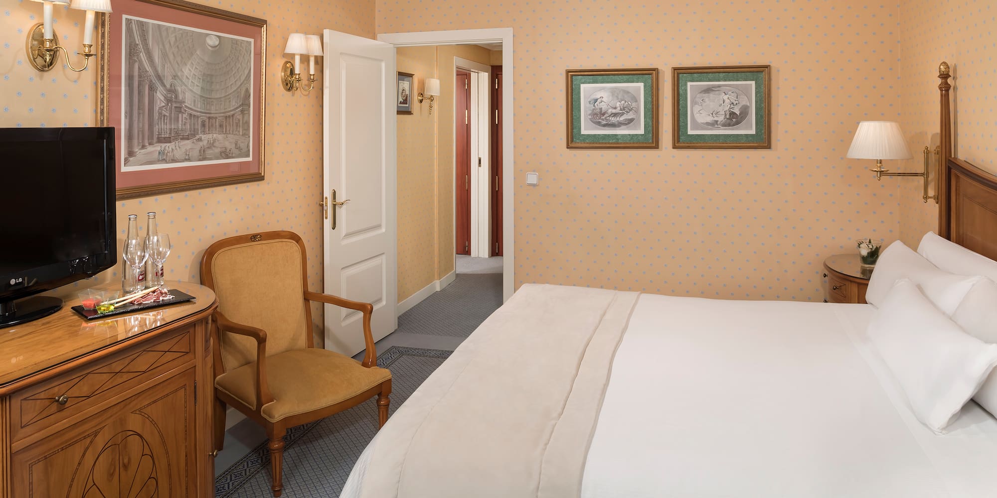 a bedroom with a bed and a chair