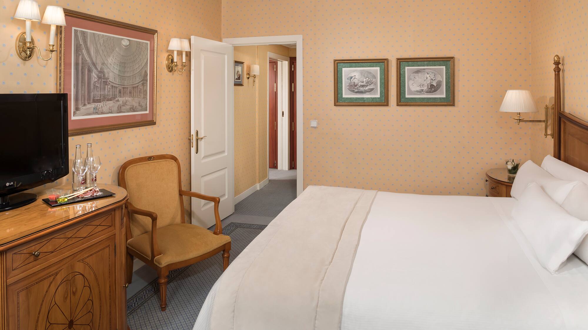 a bedroom with a bed and a chair